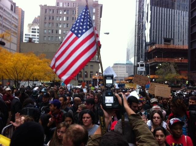 OWS Protestors in pen surrounded by NYPD officers.